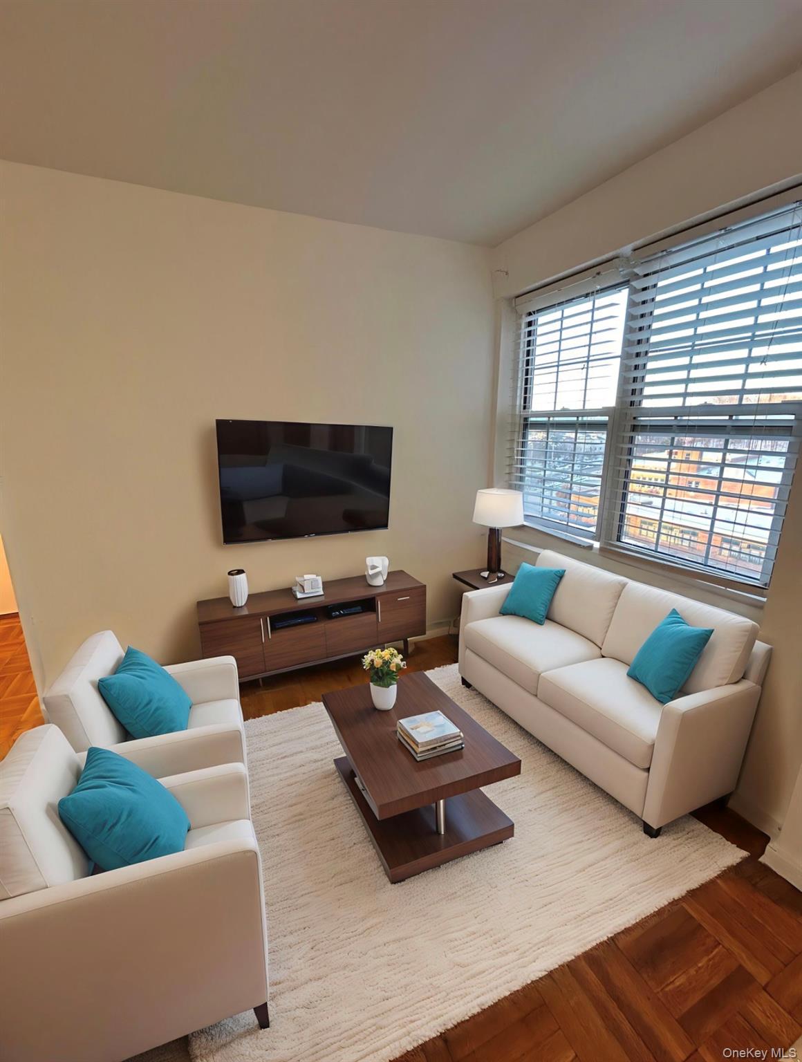 a living room with furniture and a flat screen tv