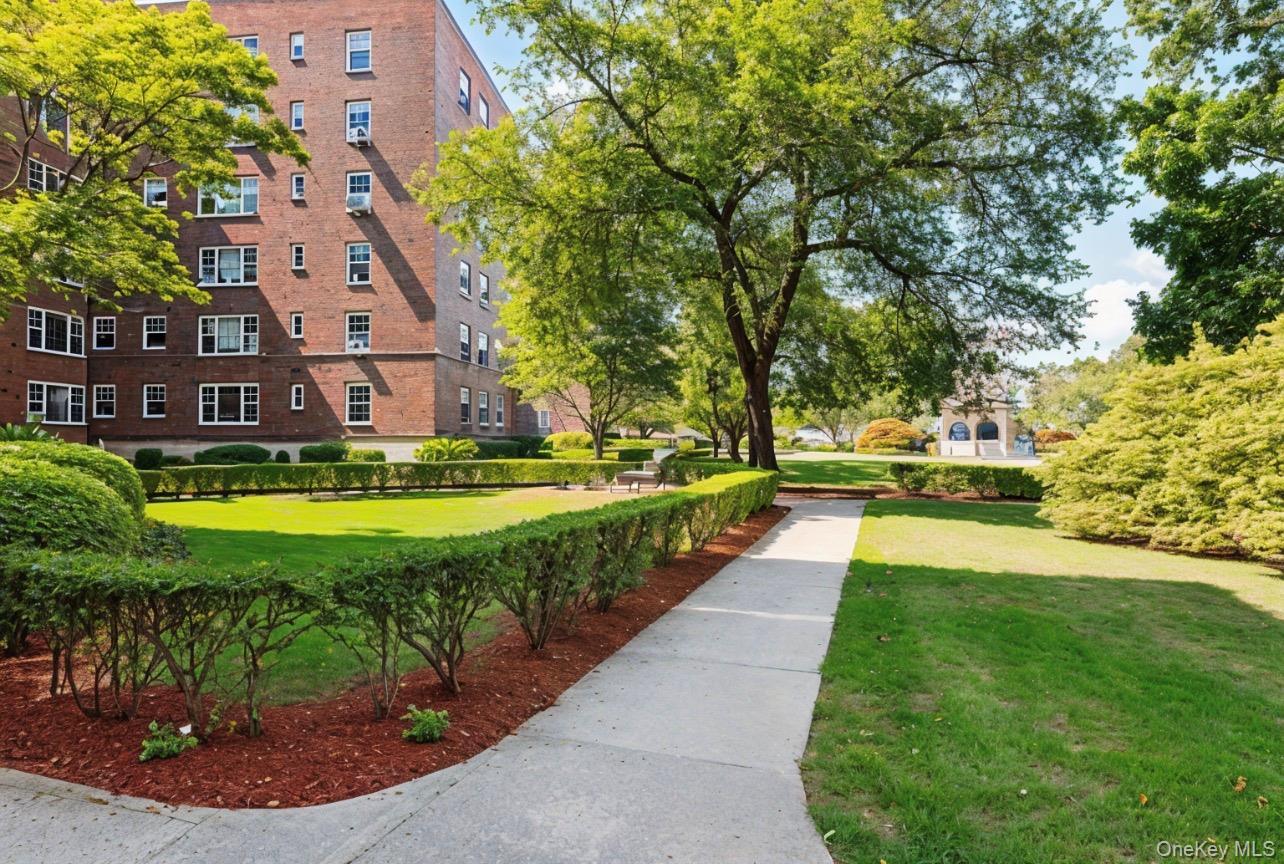 210 Pelham Road, Unit 5P New Rochelle, NY 10805 - Photo 24 of 25 a view of swimming pool with outdoor seating and yard