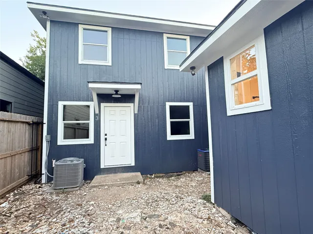 a front view of a house with parking