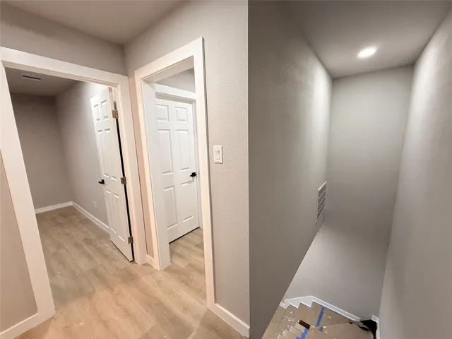 wooden floor in a hall with an entryway