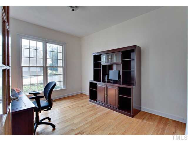 Office or formal living room boasts lots of windows, french doors, and hardwood floors. Other