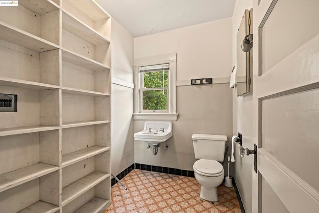 a bathroom with a toilet a sink and a shower