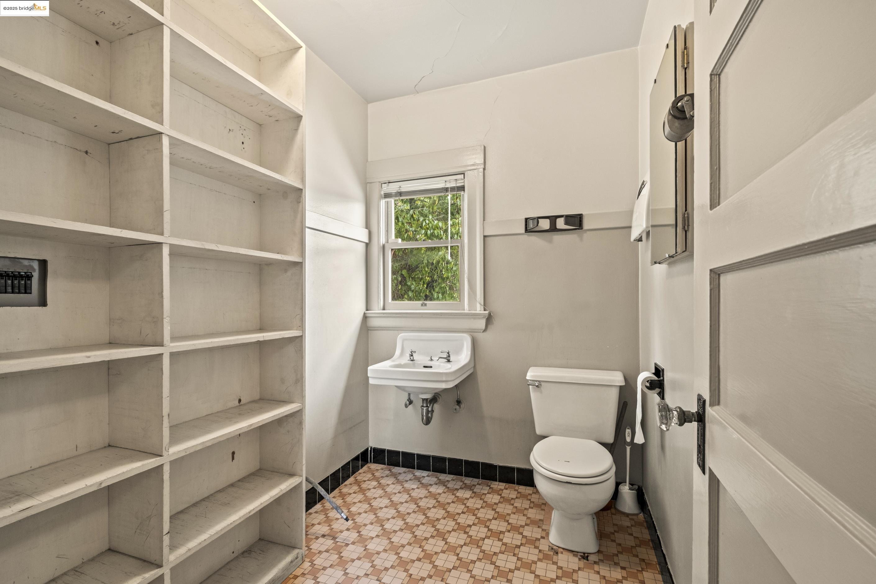 3050 Shattuck Avenue Berkeley, CA 94705 - Photo 21 of 41 a bathroom with a toilet a sink and a shower