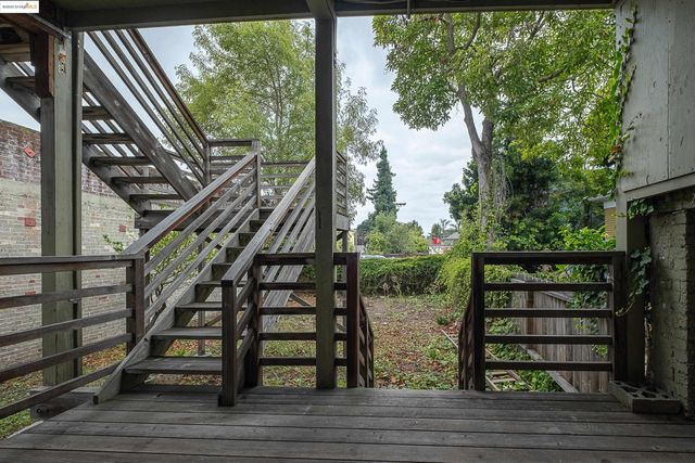 a view of entryway with wooden floor and fence