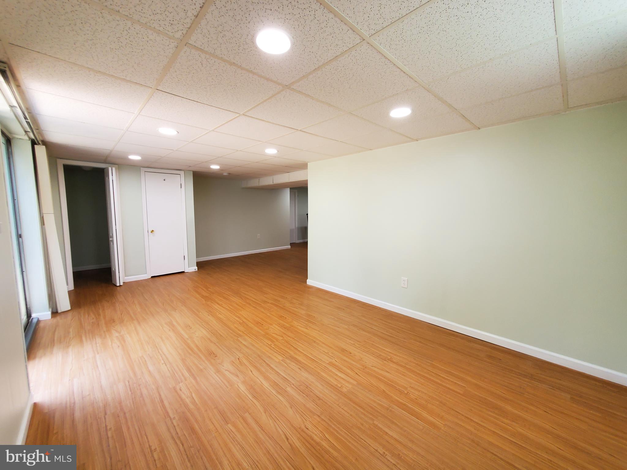 1512 Customs Road Baltimore, MD 21237 - Photo 26 of 43 an empty room with wooden floor