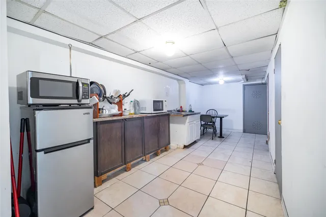 a view of a livingroom with an empty space and a window