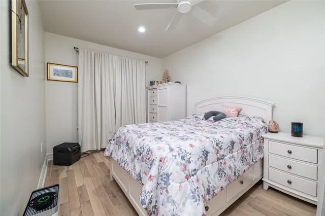 a bedroom with a bed and a dresser