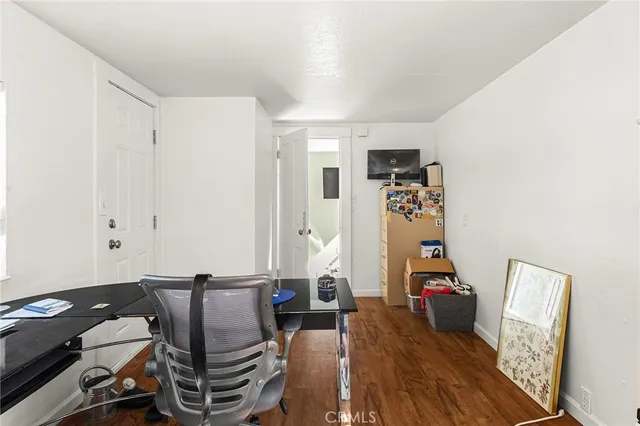 a front view of a house with outdoor seating