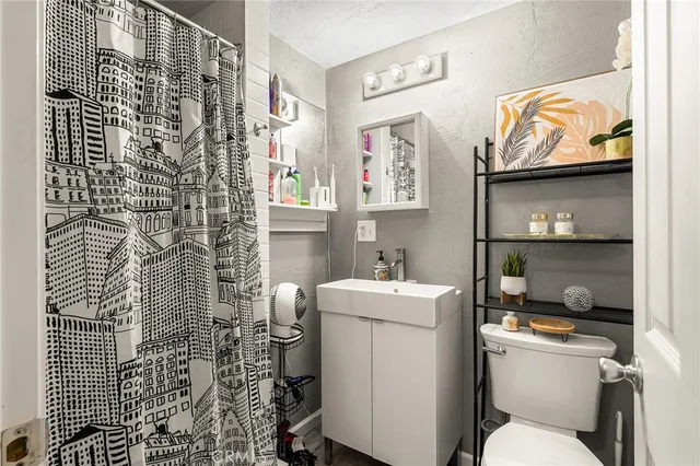 a kitchen with stainless steel appliances a white cabinets and a stove