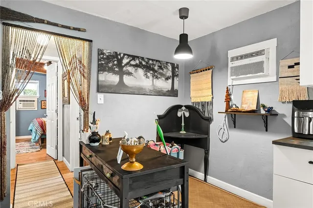 a view of a backyard with plants and a tree