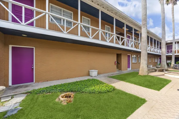 a backyard of a house with outdoor seating