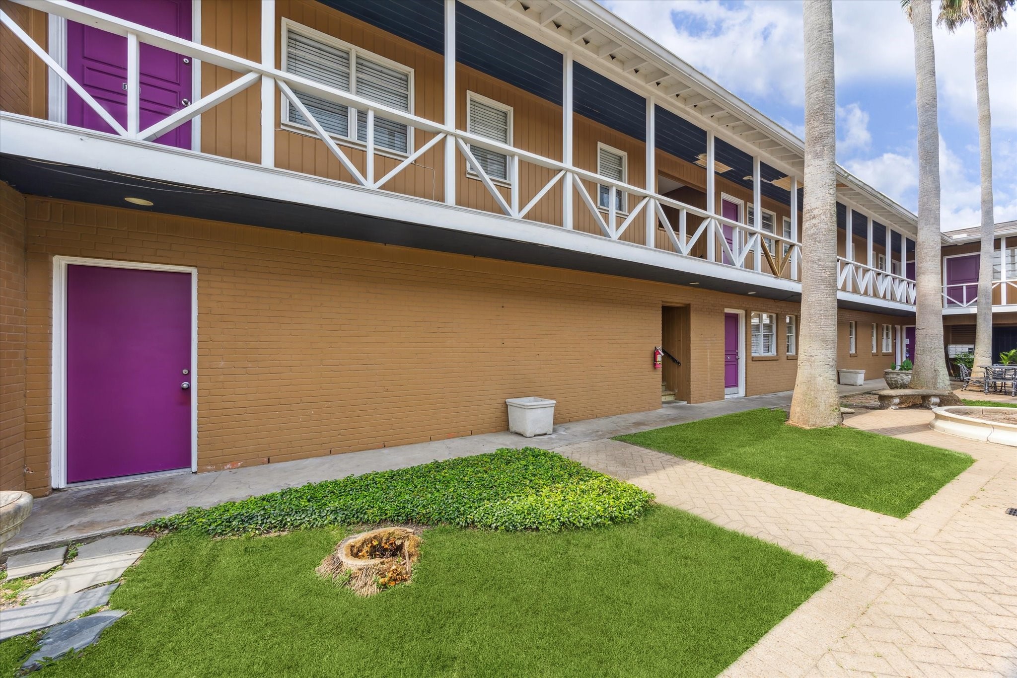 3618 Garrott Street, Unit 12 Houston, TX 77006 - Photo 11 of 13 a backyard of a house with outdoor seating