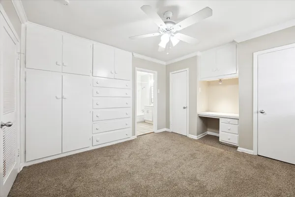 a view of an empty room with a bathroom