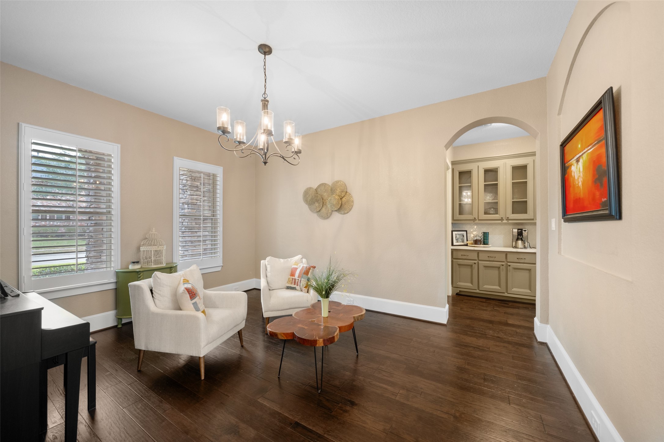 1702 Hunters Trail Friendswood, TX 77546 - Photo 11 of 42 a living room with furniture two window and wooden floor