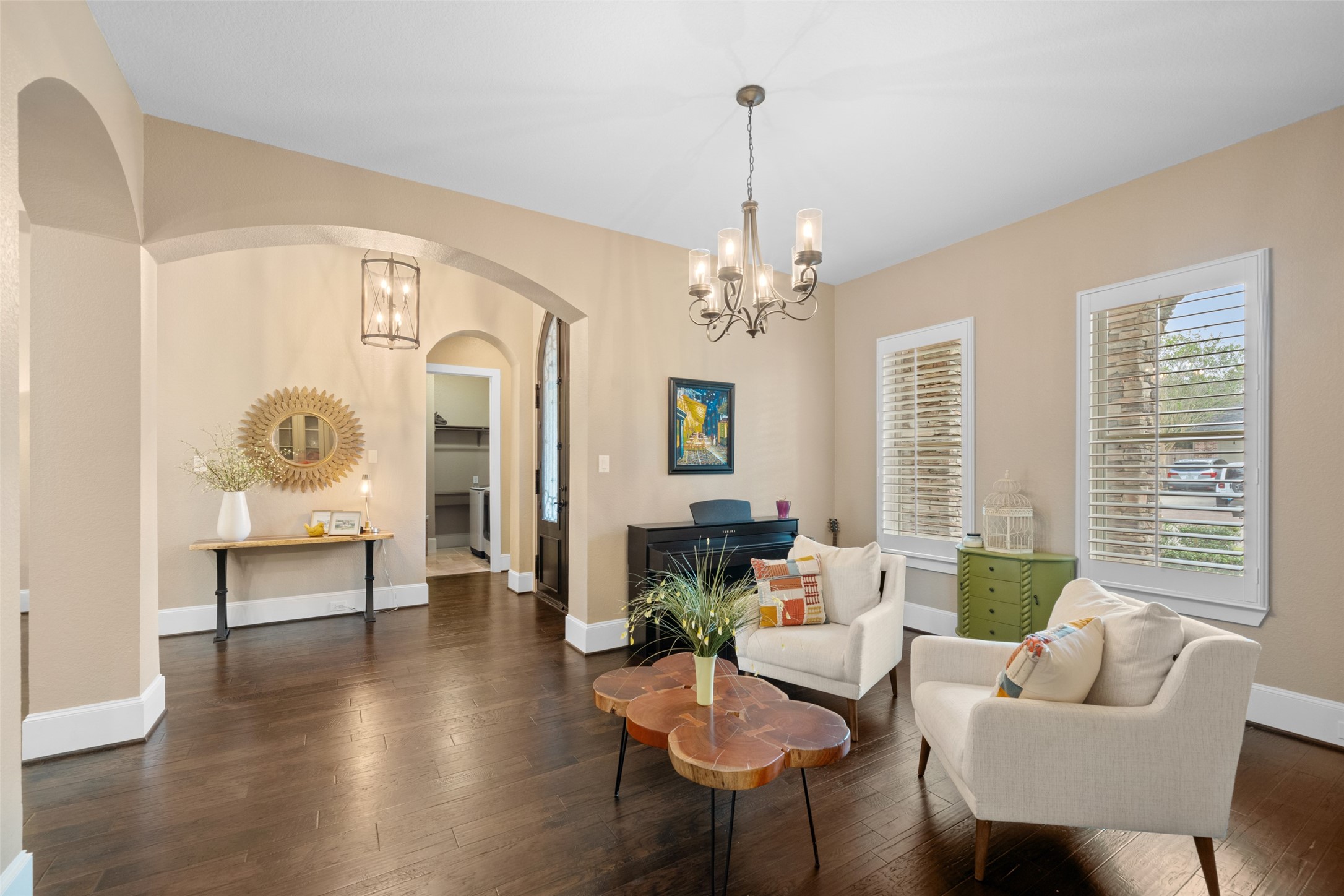 1702 Hunters Trail Friendswood, TX 77546 - Photo 12 of 42 a living room with furniture and a chandelier