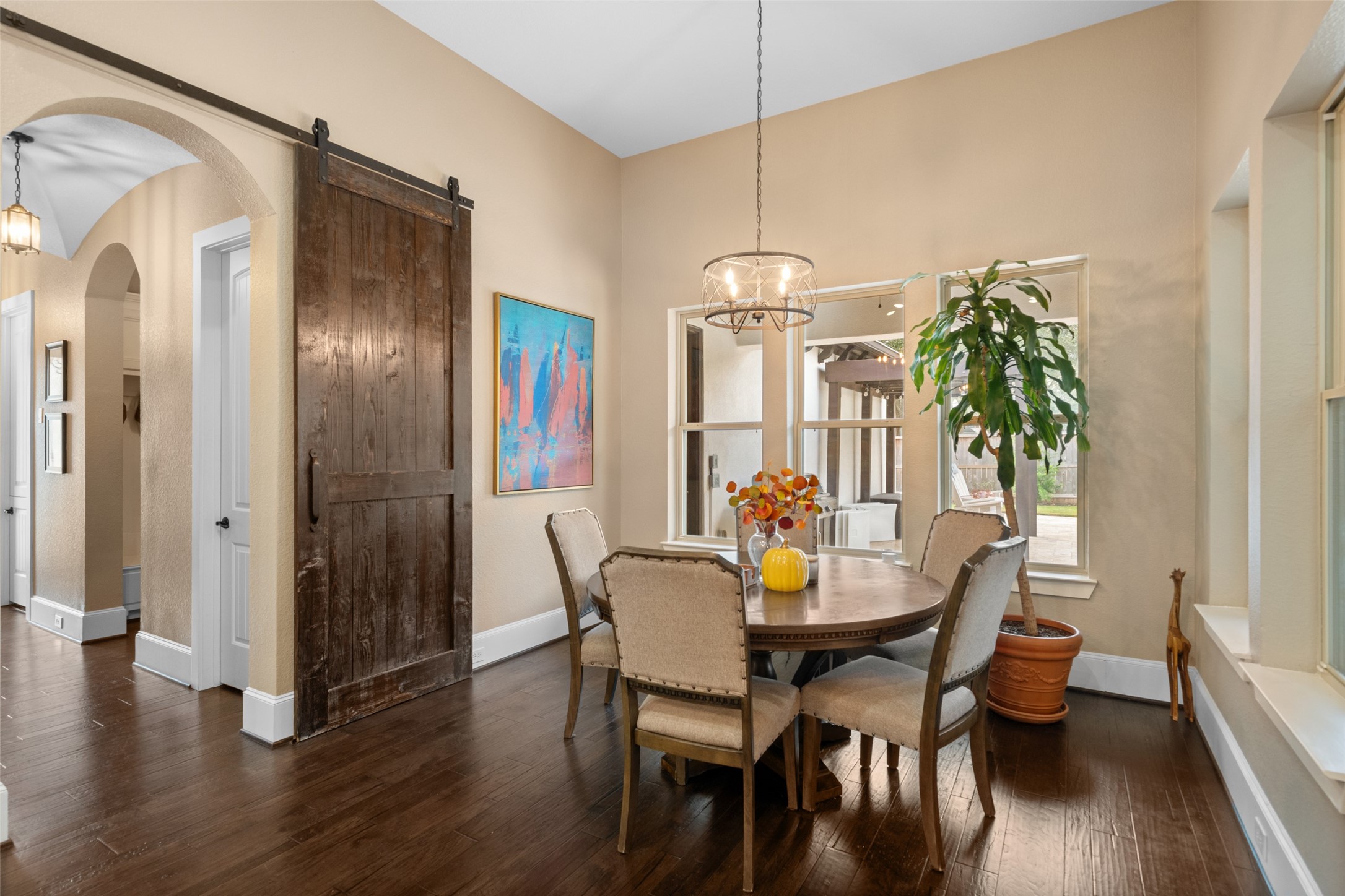 1702 Hunters Trail Friendswood, TX 77546 - Photo 18 of 42 a view of a dining room with furniture window and wooden floor