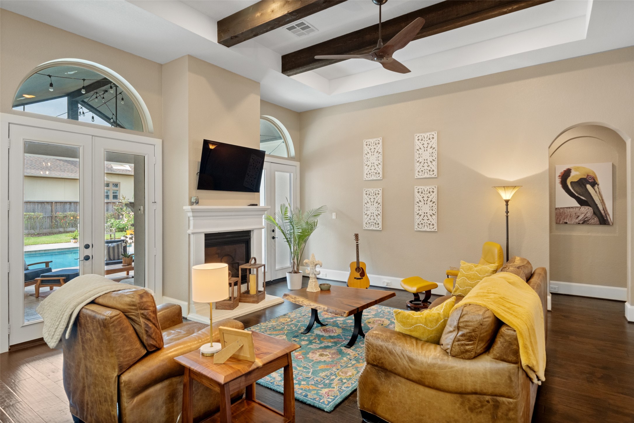 1702 Hunters Trail Friendswood, TX 77546 - Photo 22 of 42 a living room with furniture fireplace and a flat screen tv