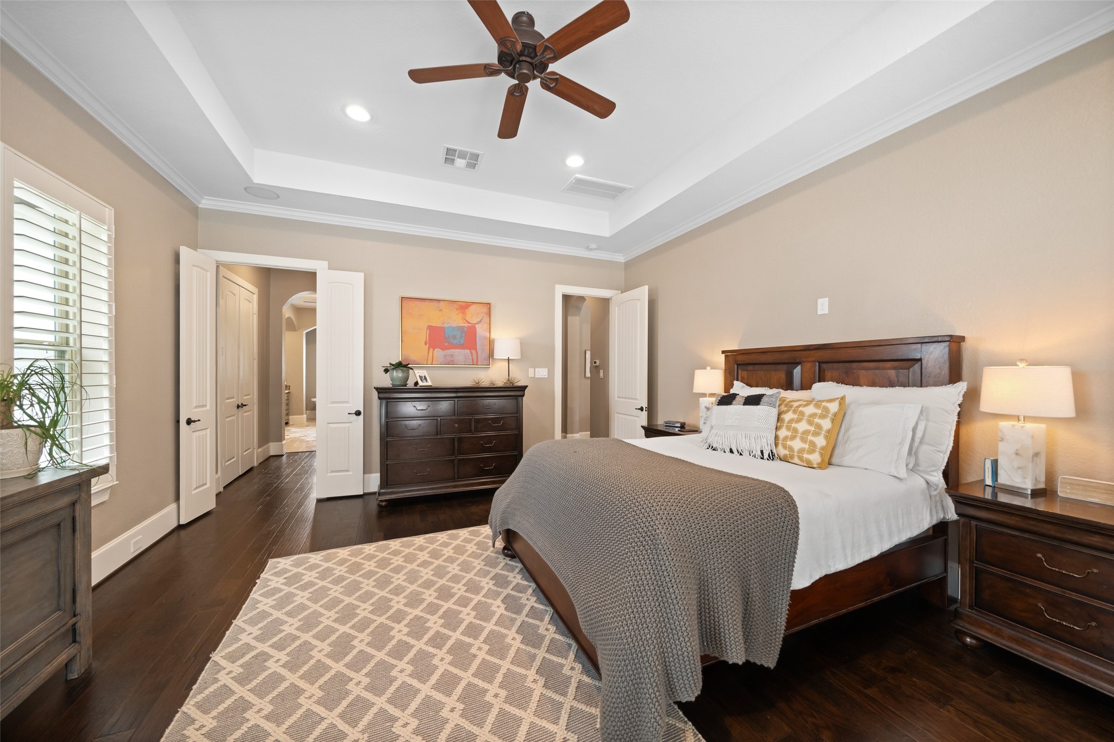 1702 Hunters Trail Friendswood, TX 77546 - Photo 24 of 42 a bedroom with a bed and wooden floor