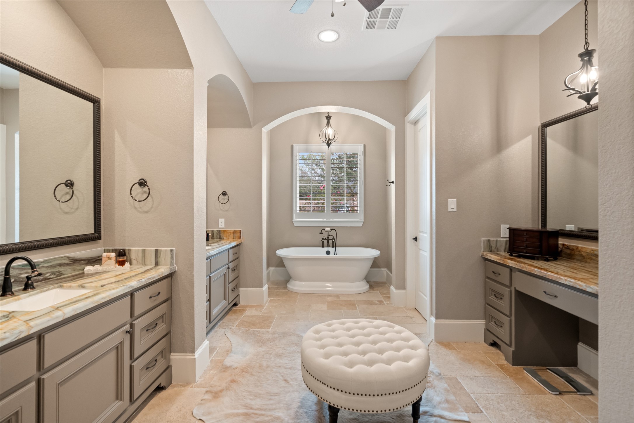 1702 Hunters Trail Friendswood, TX 77546 - Photo 26 of 42 a spacious bathroom with a granite countertop sink a toilet a mirror and vanity
