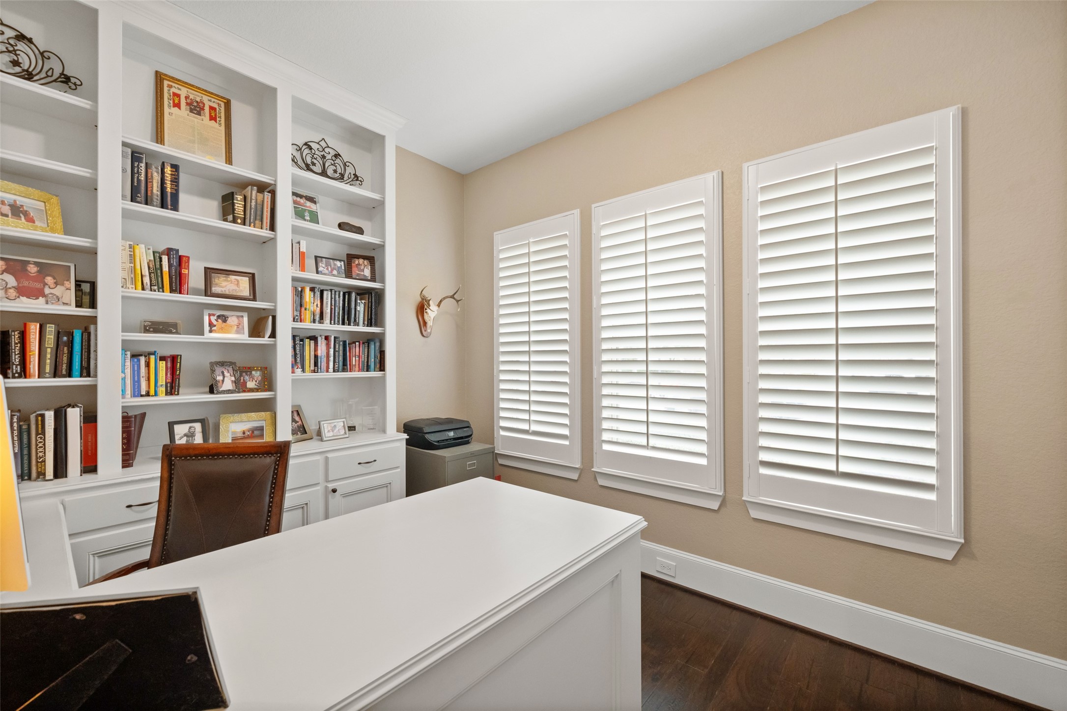 1702 Hunters Trail Friendswood, TX 77546 - Photo 27 of 42 a room with a large window and a bookshelf