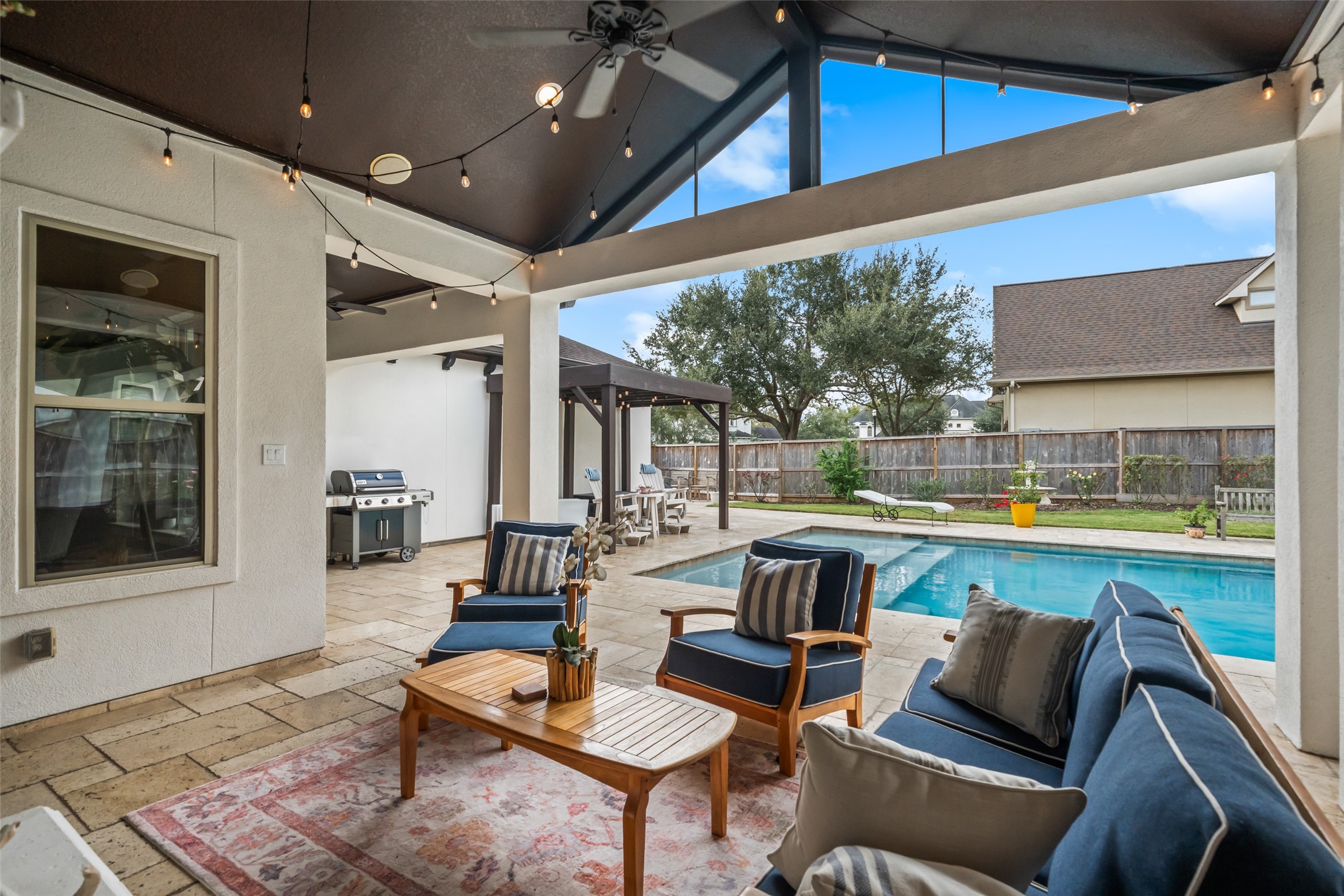 1702 Hunters Trail Friendswood, TX 77546 - Photo 37 of 42 a outdoor space with patio the couches and a dining table with the view of kitchen