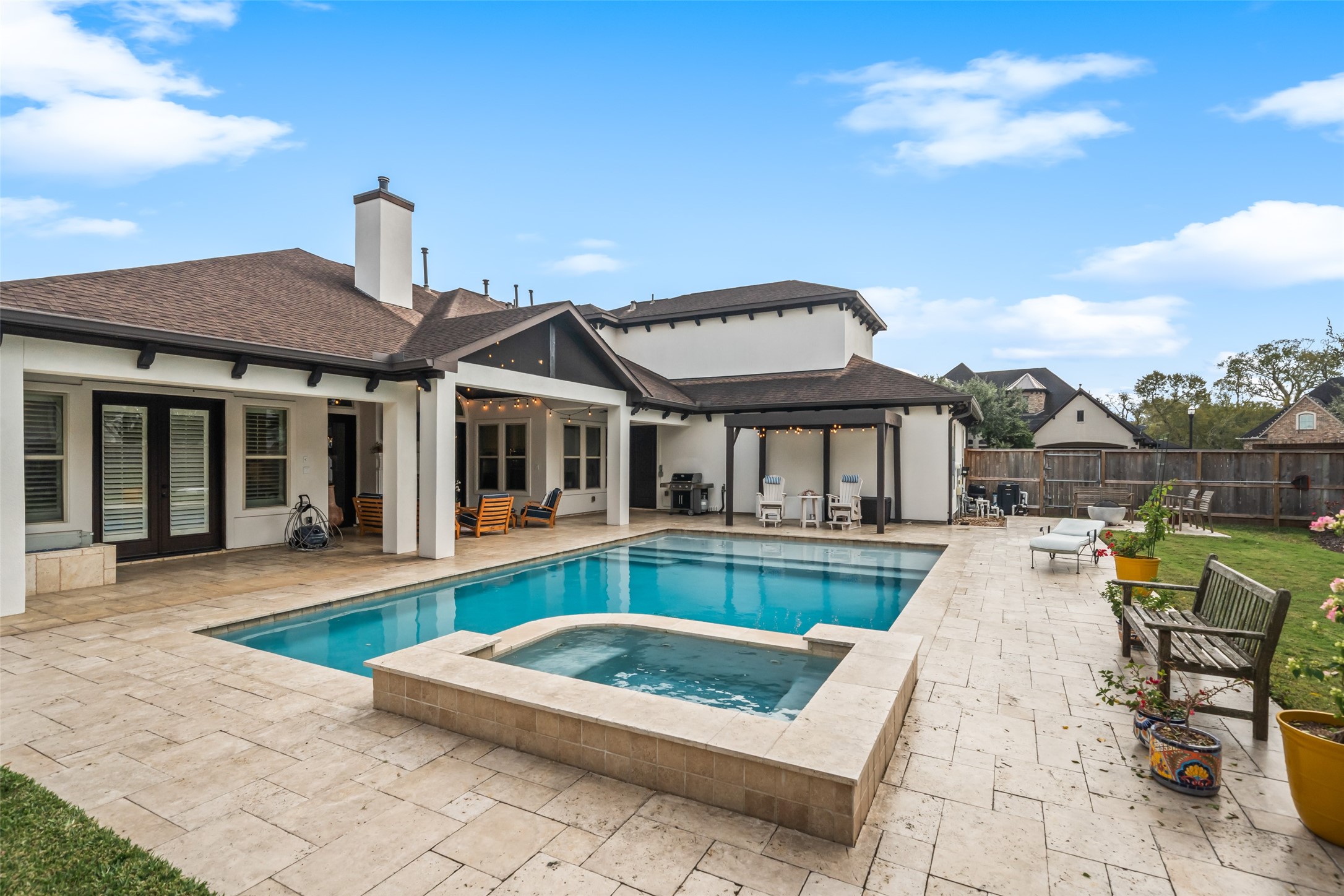 1702 Hunters Trail Friendswood, TX 77546 - Photo 40 of 42 a view of a house with swimming pool and sitting area