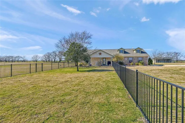 a view of swimming pool with a yard