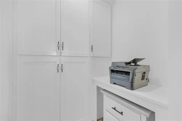 a kitchen with cabinets and appliances