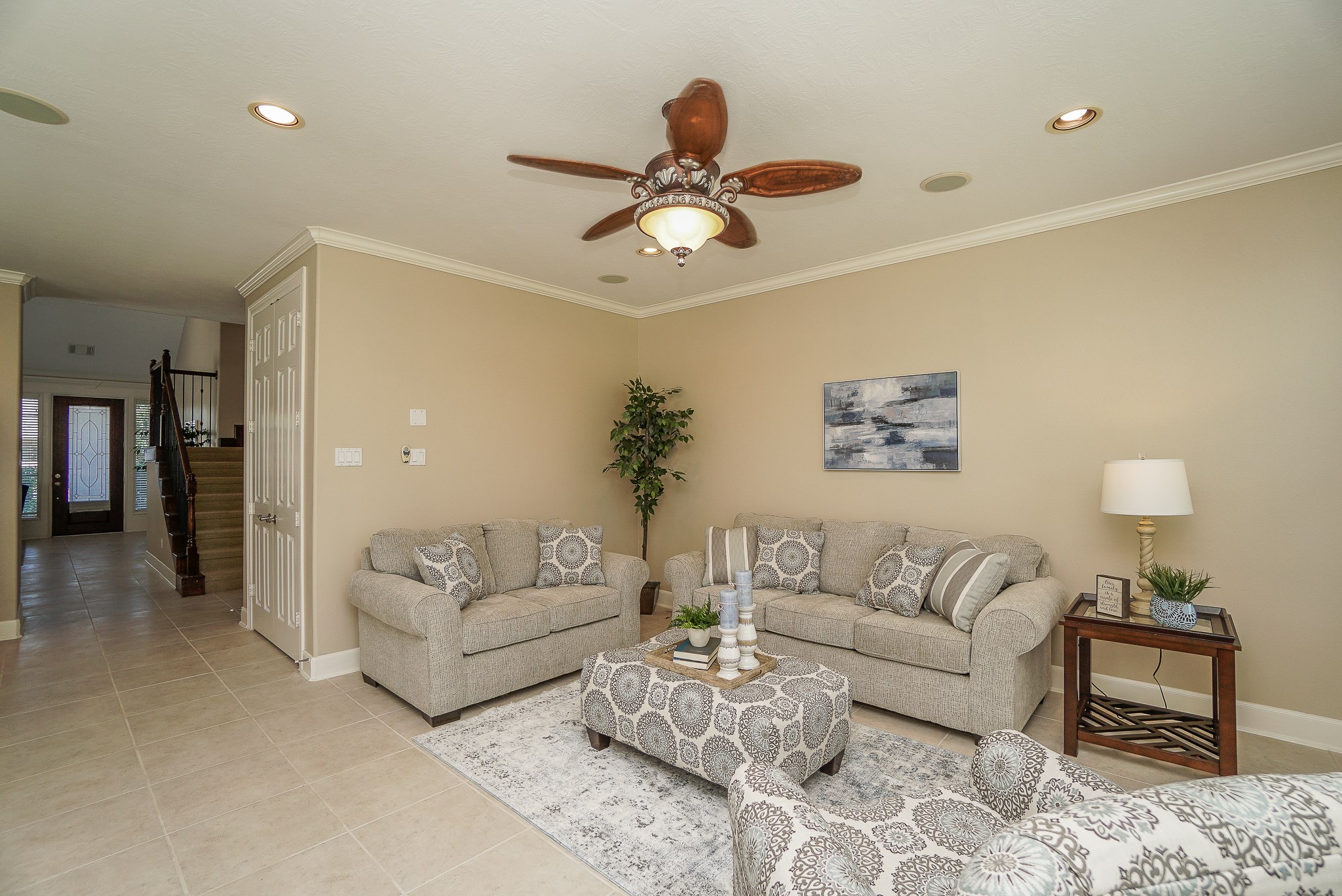 2335 Ralston Branch Way Sugar Land, TX 77479 - Photo 16 of 47 a living room with furniture a chandelier fan and a window