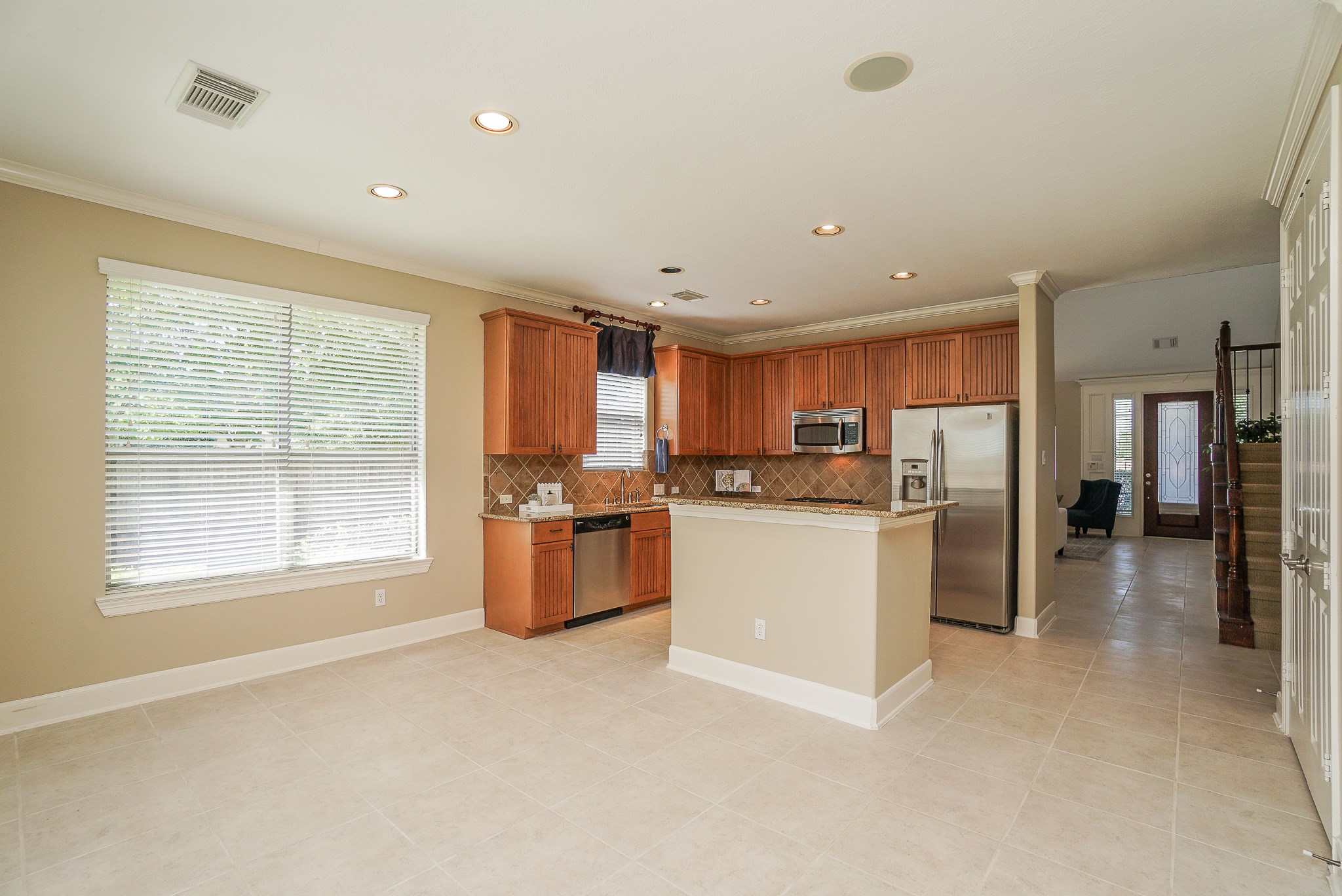 2335 Ralston Branch Way Sugar Land, TX 77479 - Photo 17 of 47 a kitchen with refrigerator and cabinets