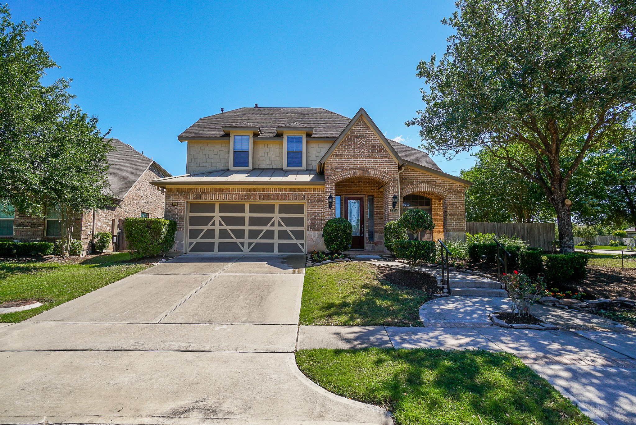 2335 Ralston Branch Way Sugar Land, TX 77479 - Photo 2 of 47 a front view of a house with a yard