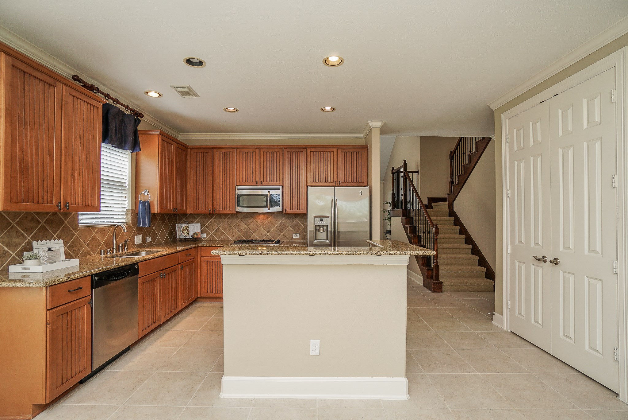 2335 Ralston Branch Way Sugar Land, TX 77479 - Photo 20 of 47 a kitchen with appliances a sink and cabinets