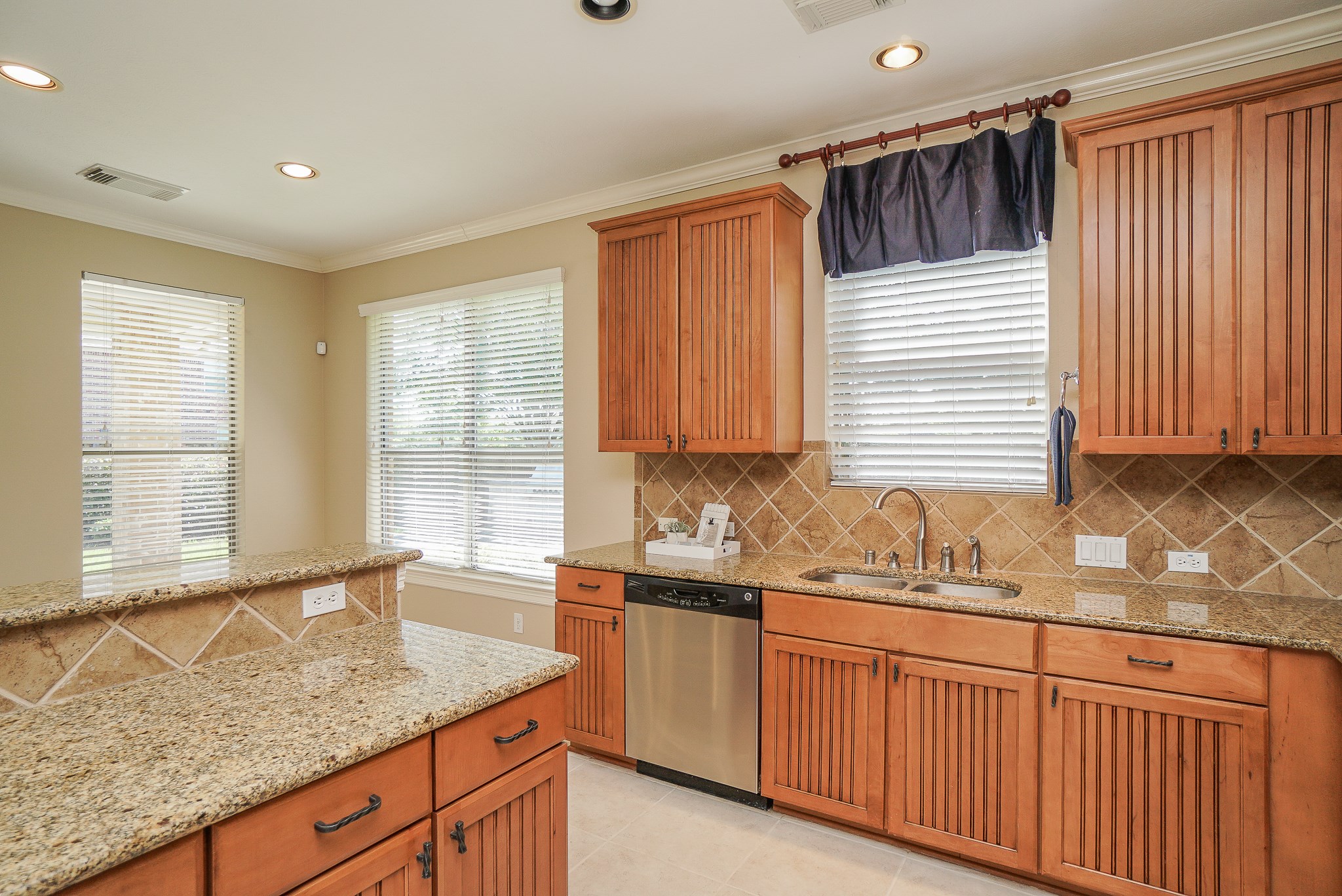 2335 Ralston Branch Way Sugar Land, TX 77479 - Photo 24 of 47 a kitchen with stainless steel appliances granite countertop a sink a counter space and a window