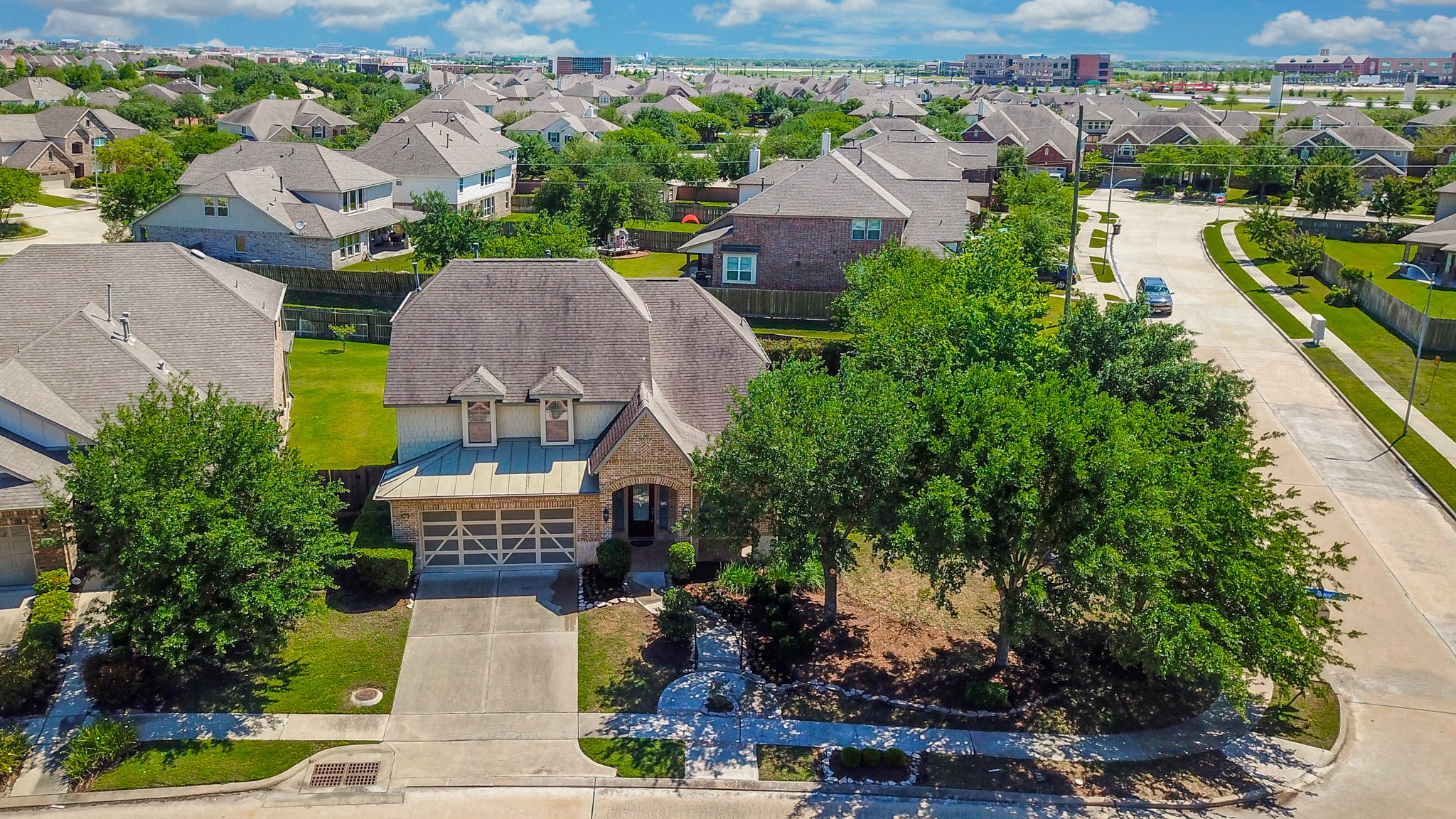 2335 Ralston Branch Way Sugar Land, TX 77479 - Photo 3 of 47 an aerial view of a house with a garden and lake view