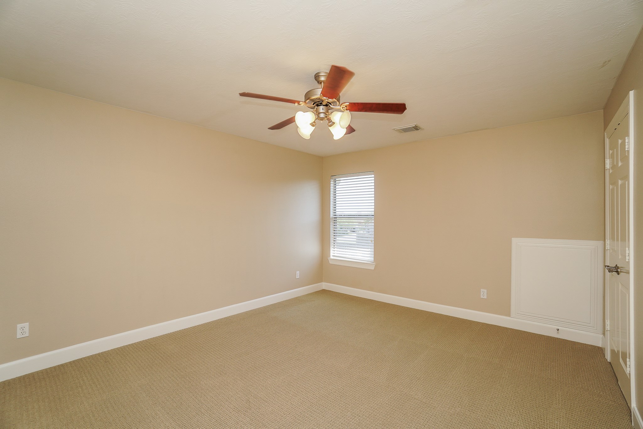 2335 Ralston Branch Way Sugar Land, TX 77479 - Photo 38 of 47 a view of a room with a window and a ceiling fan