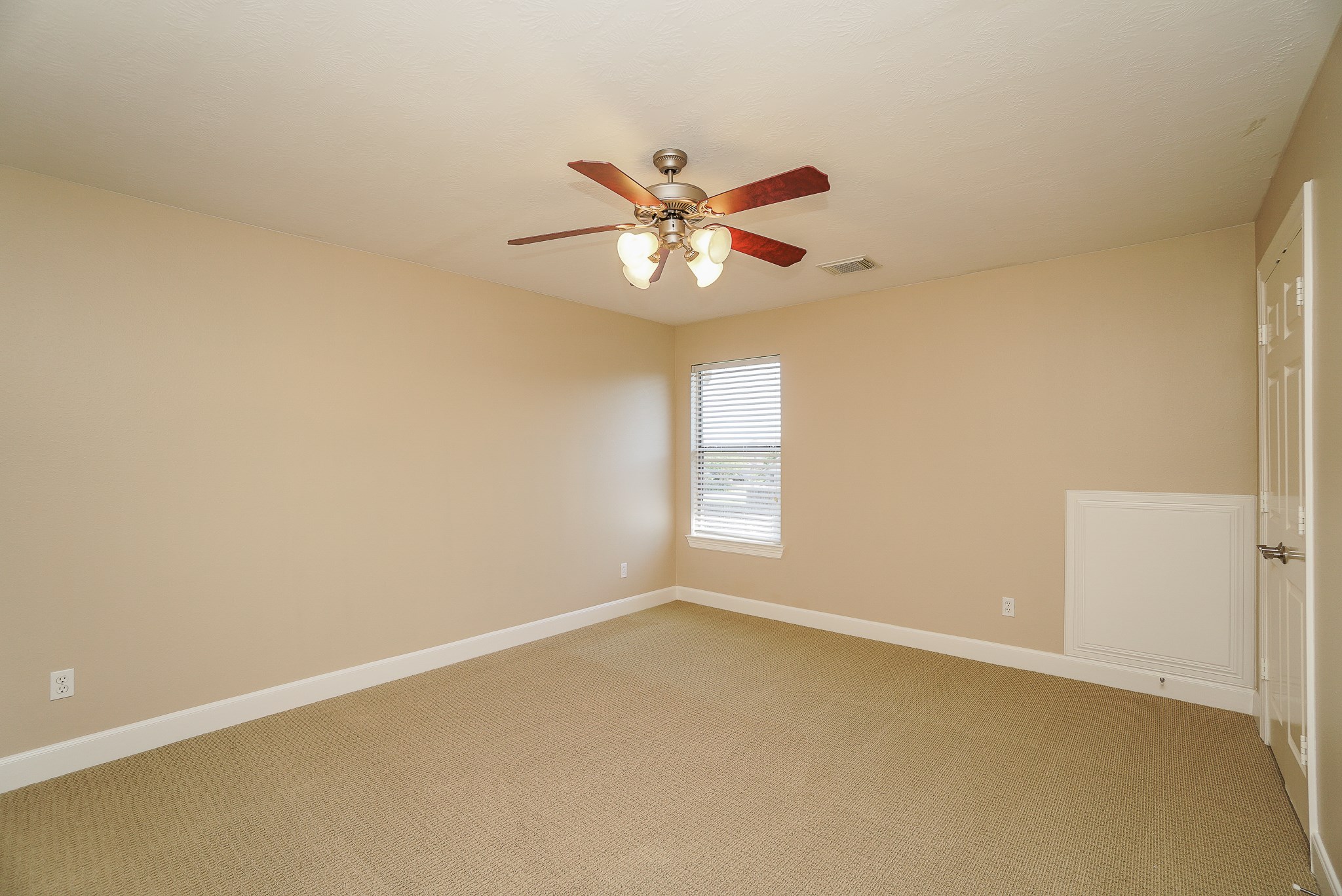 2335 Ralston Branch Way Sugar Land, TX 77479 - Photo 39 of 47 an empty room with a window and a fan