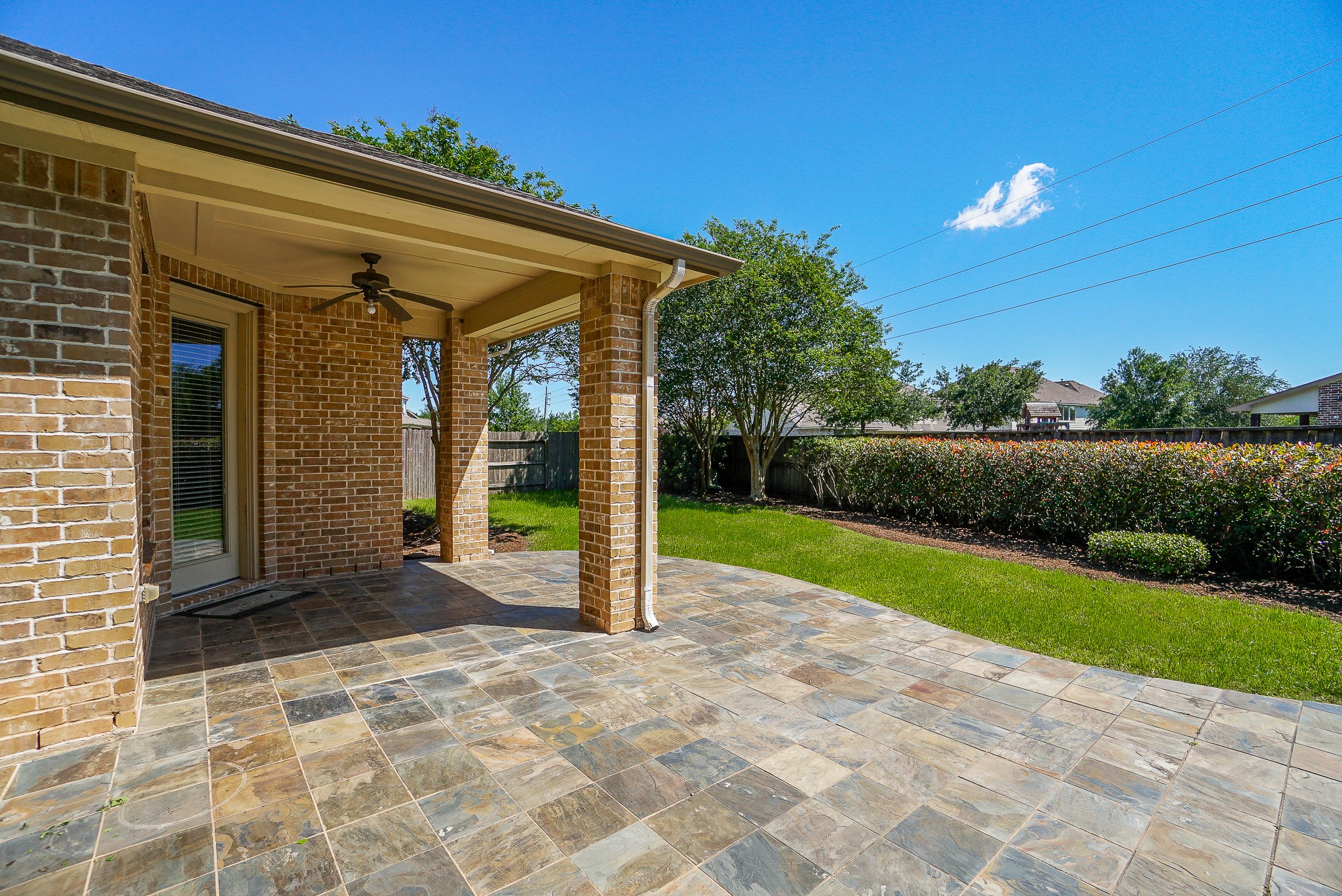 2335 Ralston Branch Way Sugar Land, TX 77479 - Photo 43 of 47 a view of a backyard with brick wall and plants