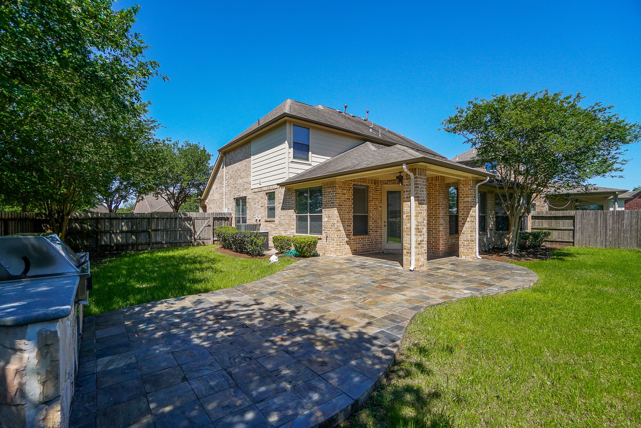 2335 Ralston Branch Way Sugar Land, TX 77479 - Photo 44 of 47 a front view of a house with a yard and porch
