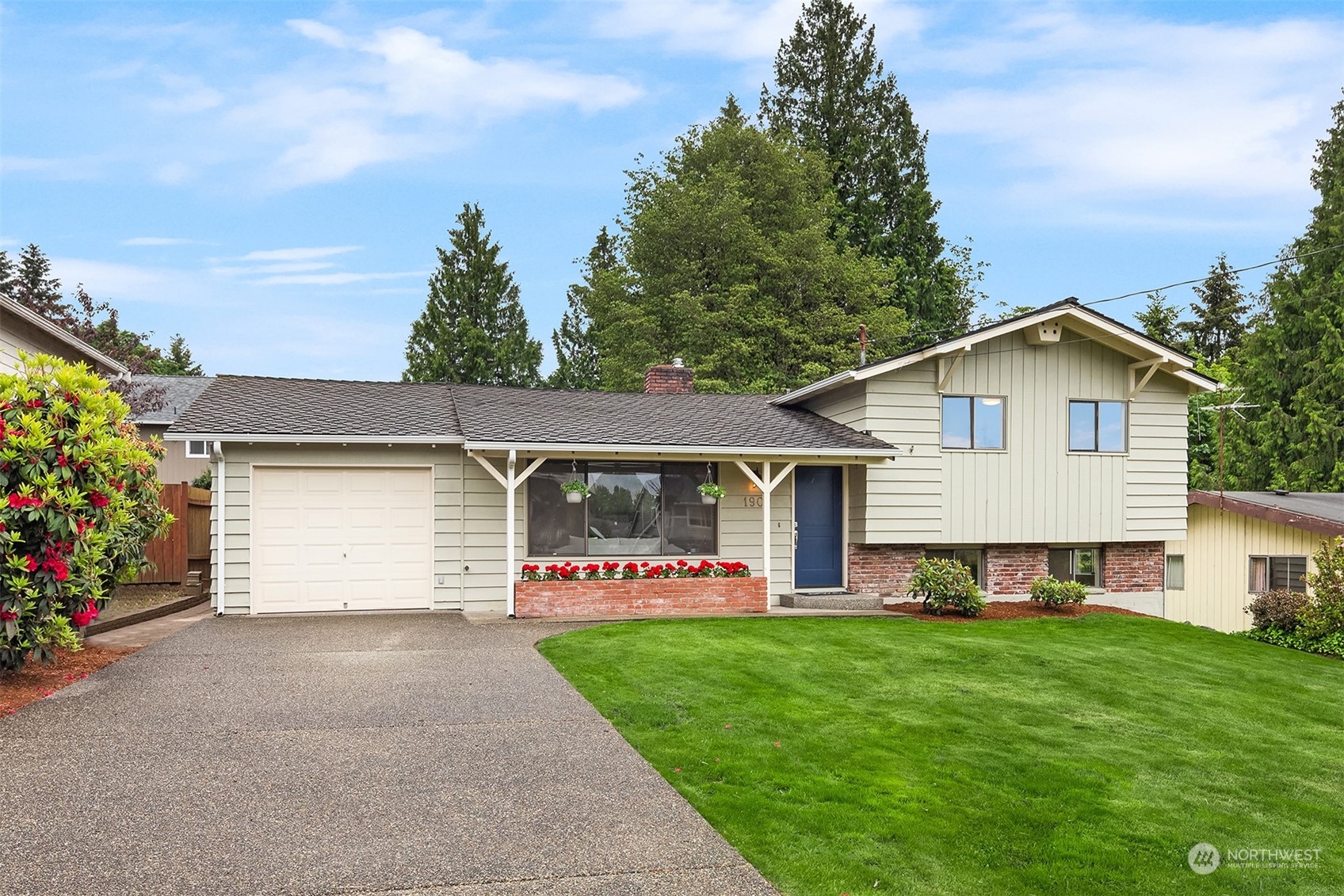 1909 Northeast 24th Street Renton, WA 98056 - Photo 1 of 34 a front view of house with yard and green space