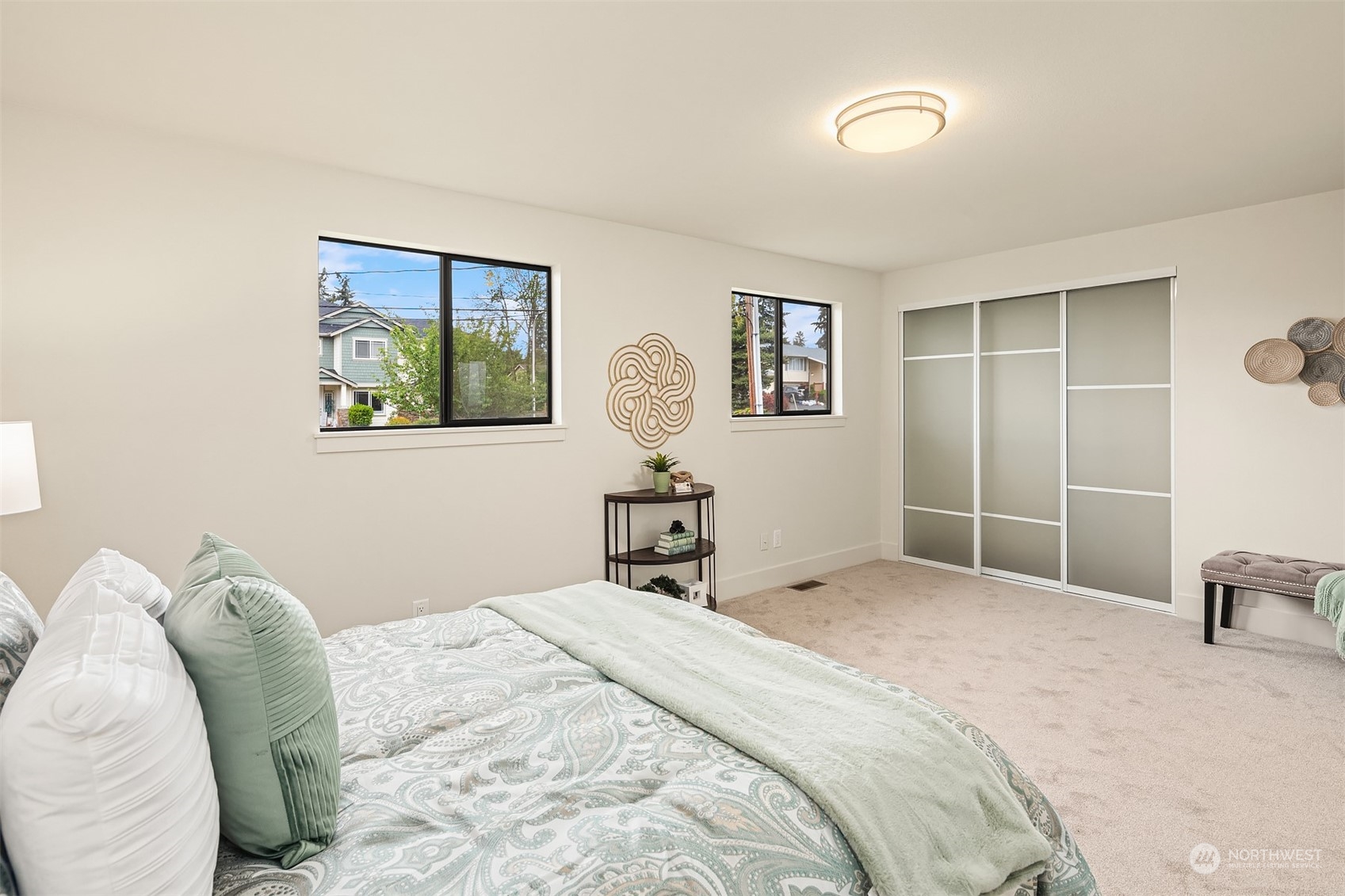 1909 Northeast 24th Street Renton, WA 98056 - Photo 16 of 34 a bedroom with a large bed and a window