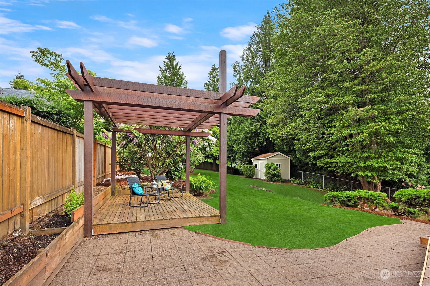1909 Northeast 24th Street Renton, WA 98056 - Photo 24 of 34 a patio view with a table and chairs and potted plants