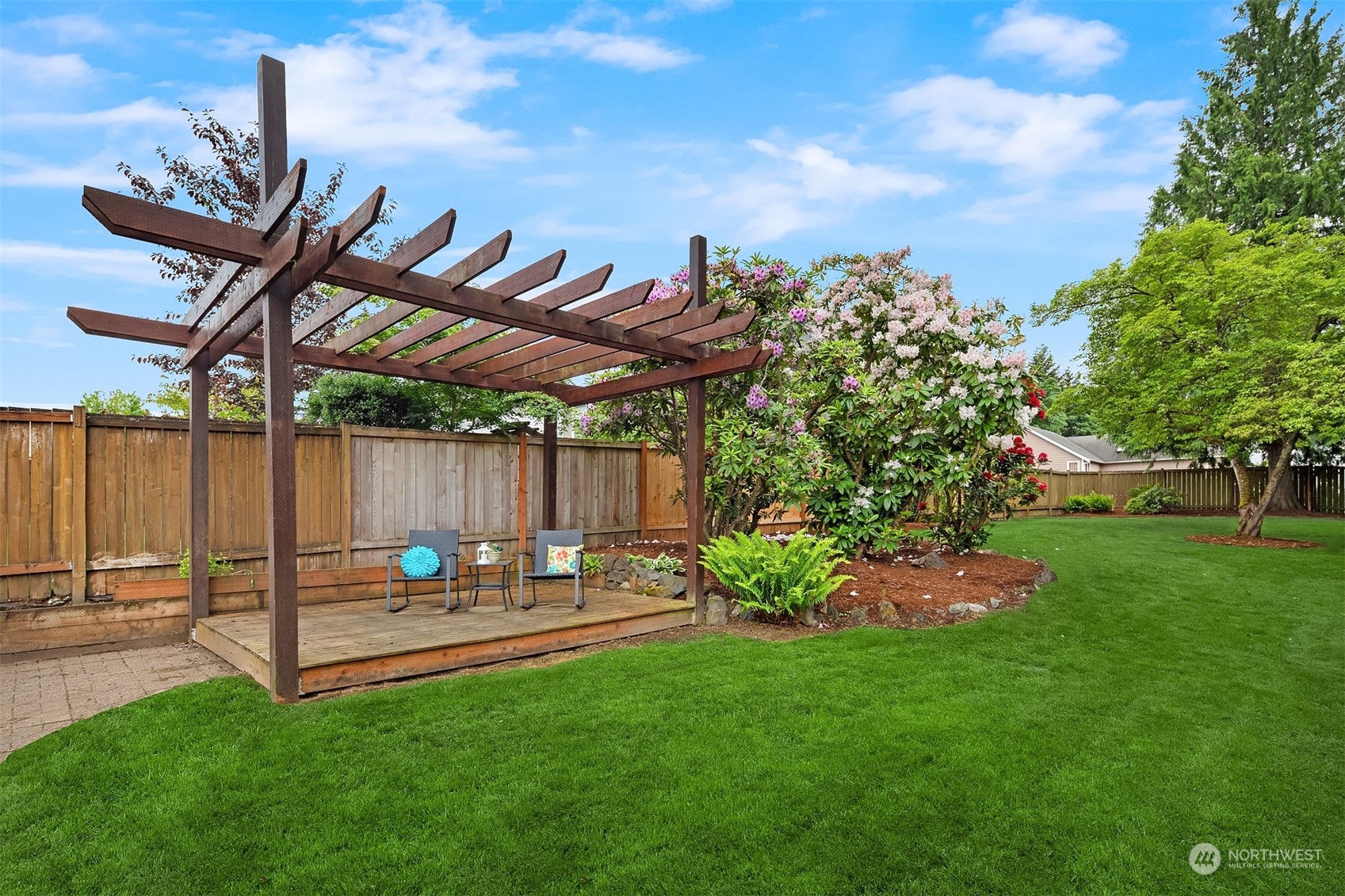 1909 Northeast 24th Street Renton, WA 98056 - Photo 25 of 34 a view of a backyard with sitting area