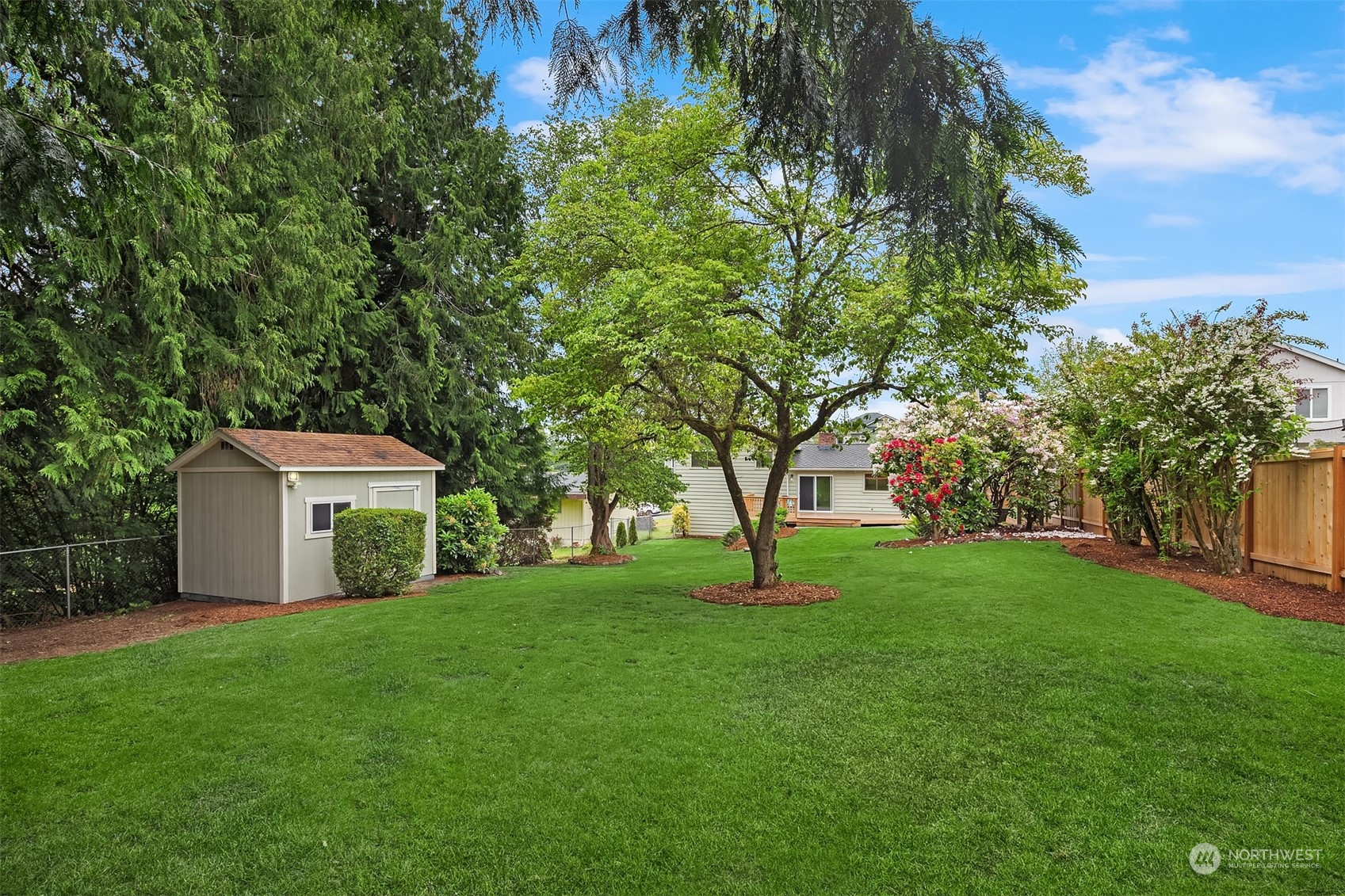 1909 Northeast 24th Street Renton, WA 98056 - Photo 29 of 34 a view of a house with a yard