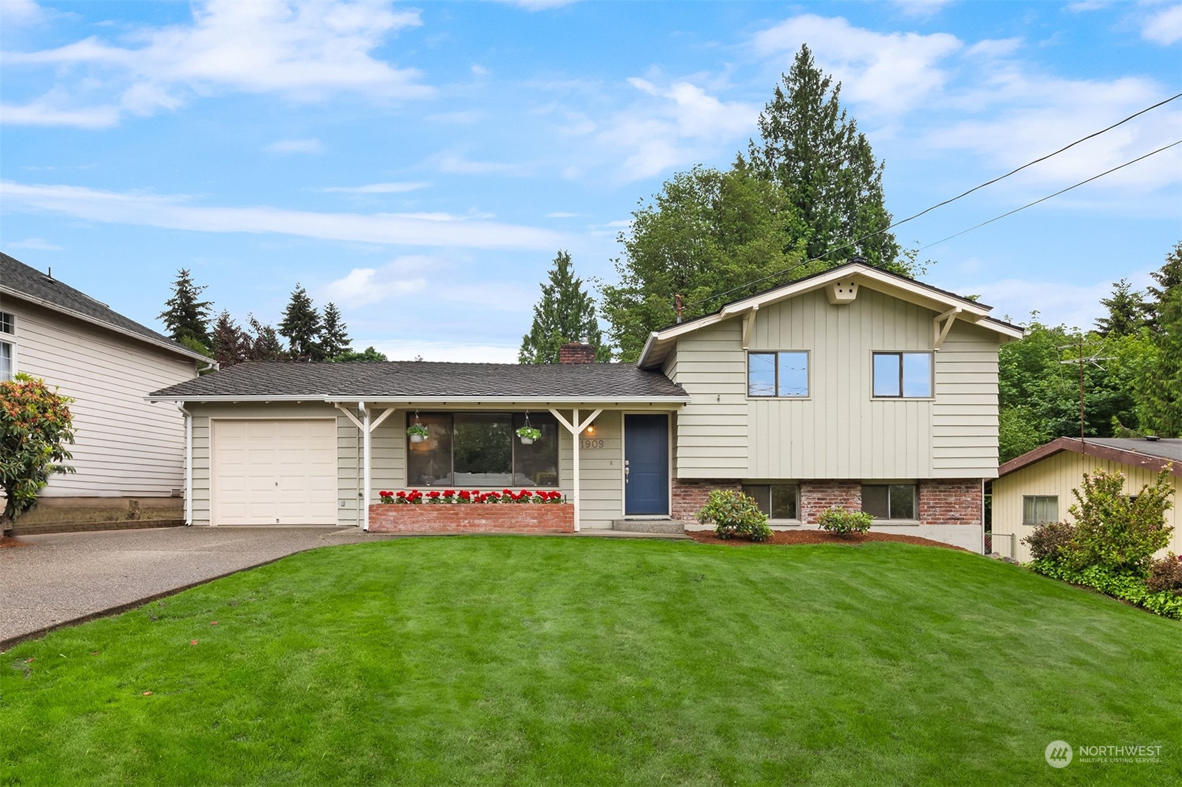 1909 Northeast 24th Street Renton, WA 98056 - Photo 33 of 34 a front view of house with yard and green space
