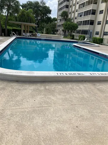 a bedroom with a bed and dresser