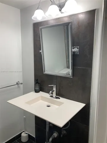 a bathroom with a toilet and a sink