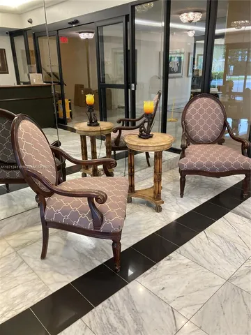 a vase of flowers sitting on a floor