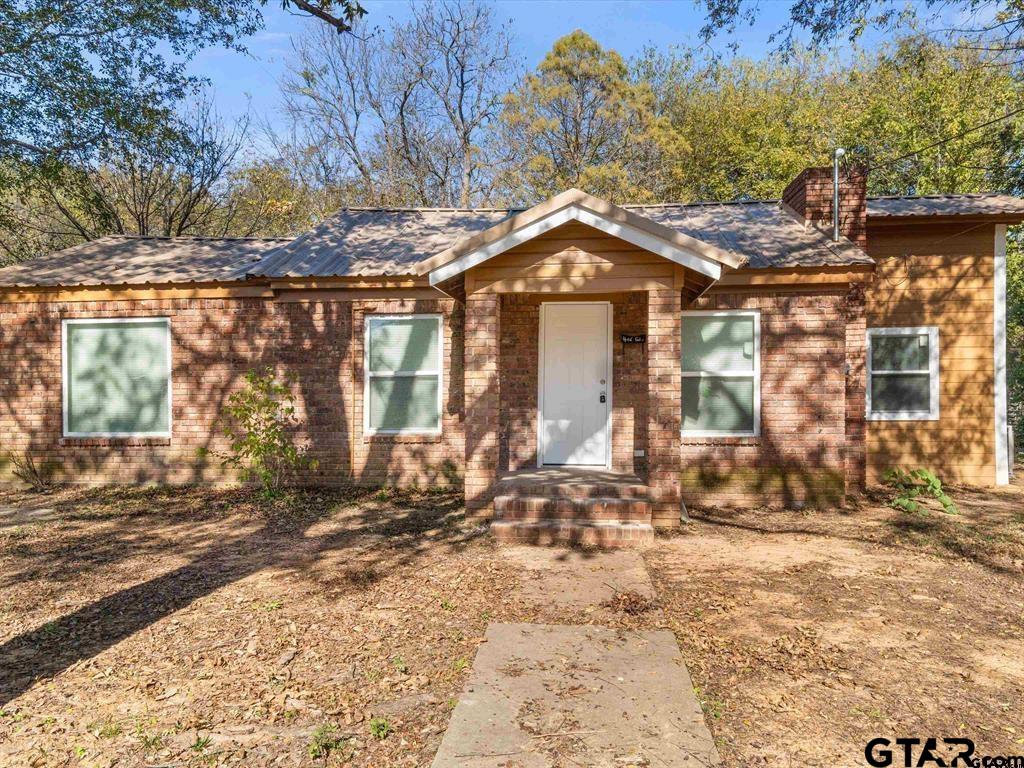406 Giles Street Mineola, TX 75773 - Photo 11 of 19 a front view of a house with a yard