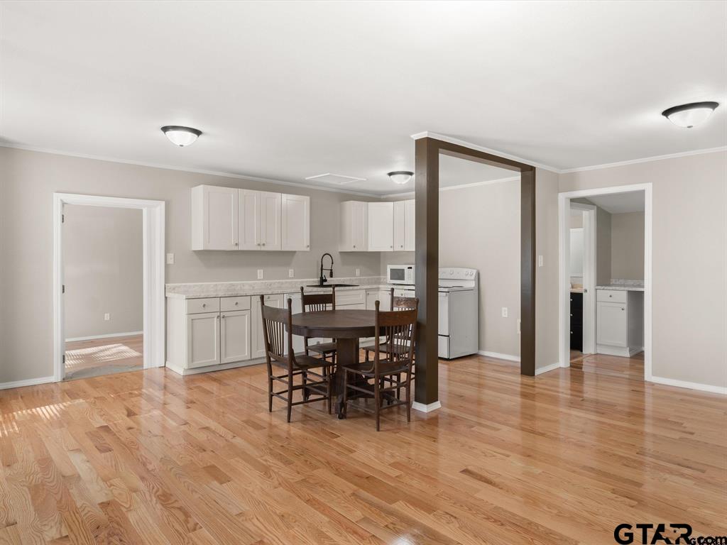 406 Giles Street Mineola, TX 75773 - Photo 12 of 19 a view of a dining room with furniture and wooden floor