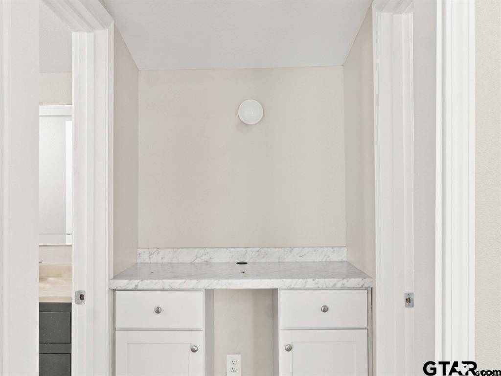 406 Giles Street Mineola, TX 75773 - Photo 18 of 19 a bathroom with a sink and vanity